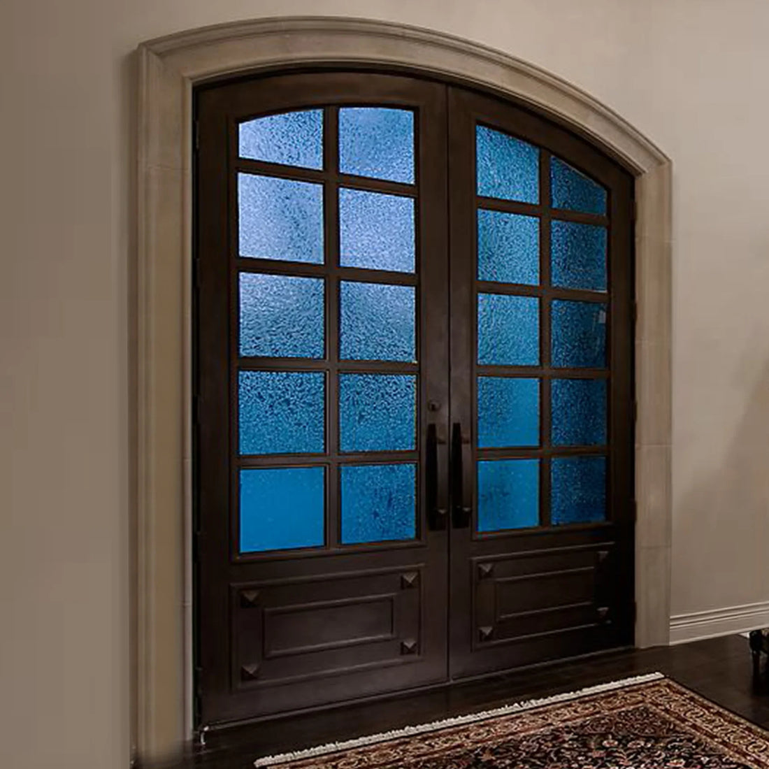 Custom arched iron front door for a Texas home