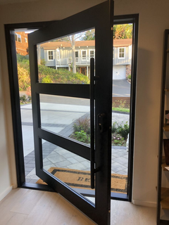 Iron pivot door 3-lite glass detail Texas Glass Door
