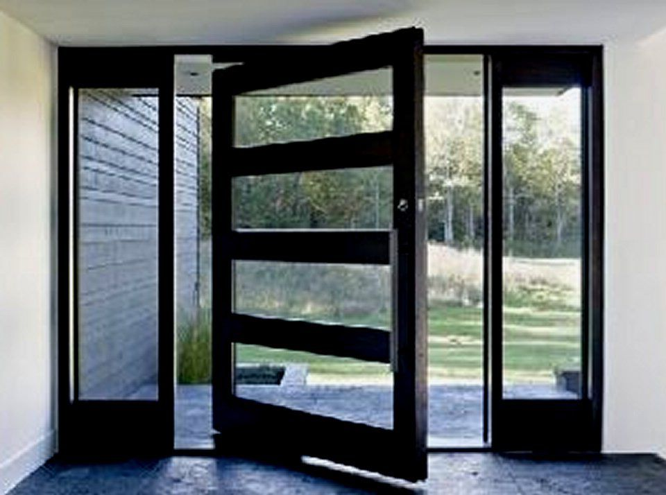 Iron pivot door 4-lite glass detail Texas Glass Door